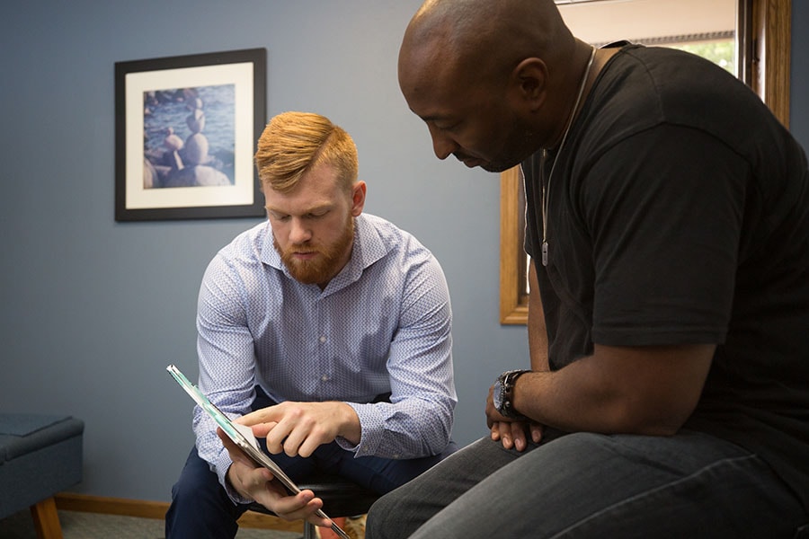 Patient meeting with Daniels Chiropractic Doctor Patient meeting with Daniels Chiropractic Doctor